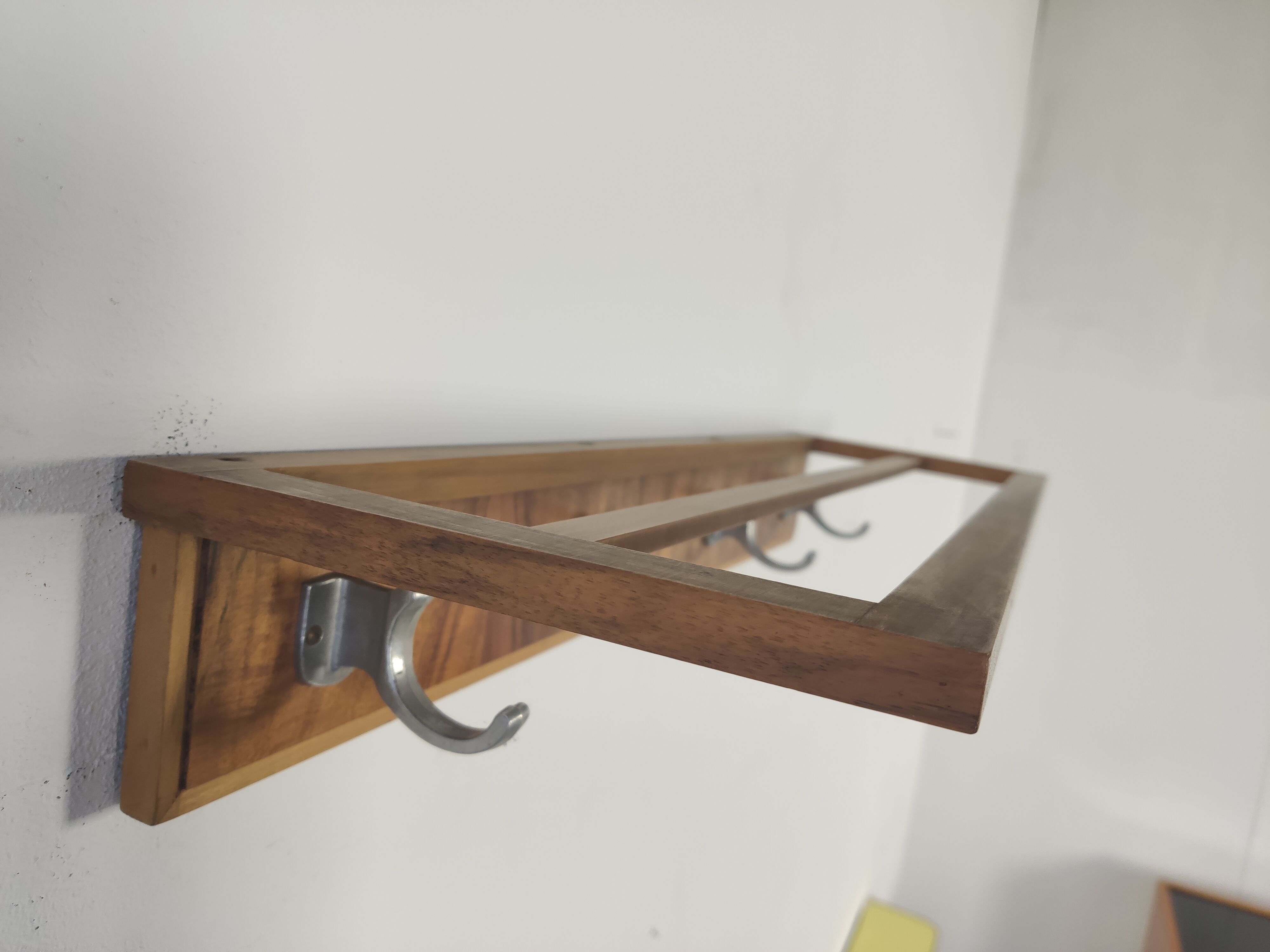 Walnut and metal wall coat rack, 1950s