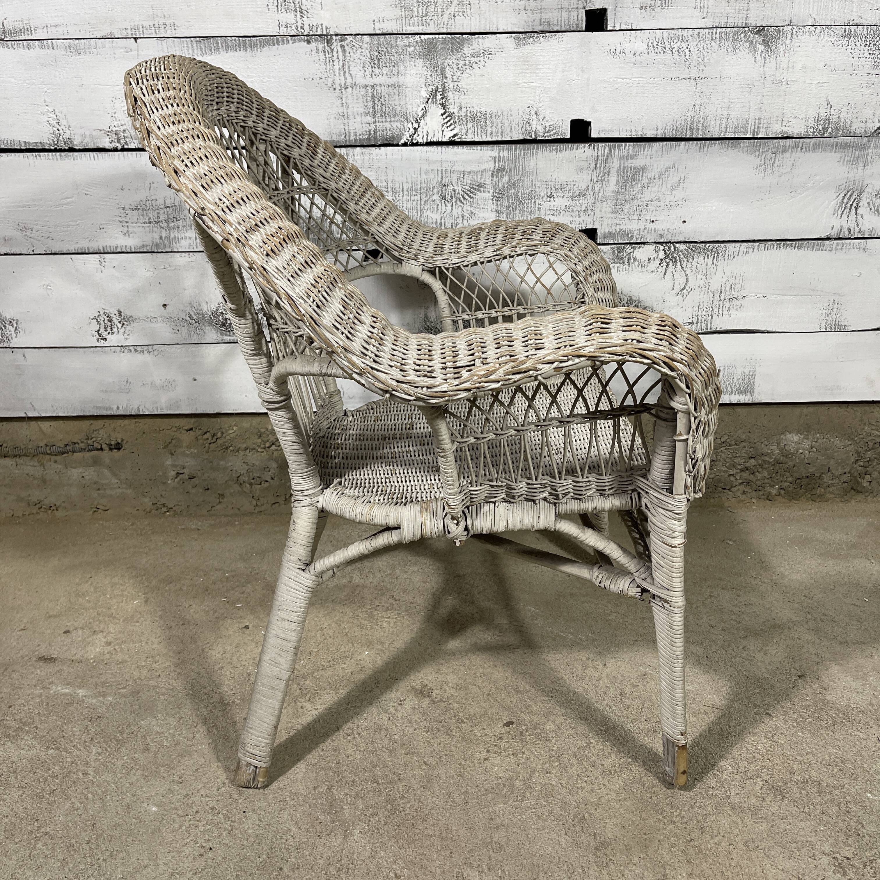 Vintage white rattan armchair