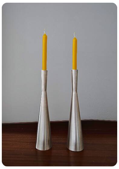 Pair of vintage brushed metal candlesticks