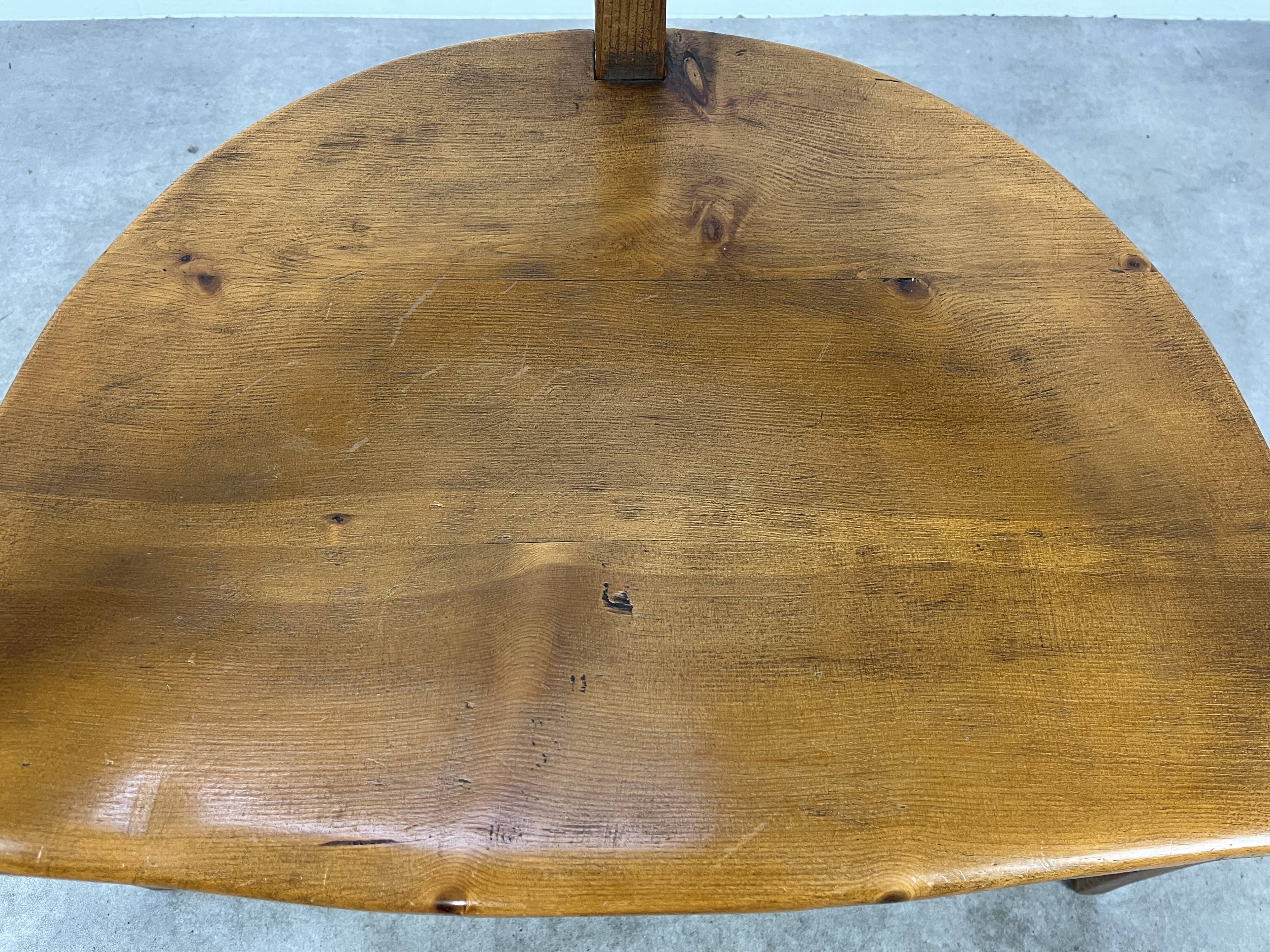 Chalet-style carved wooden tripod armchair