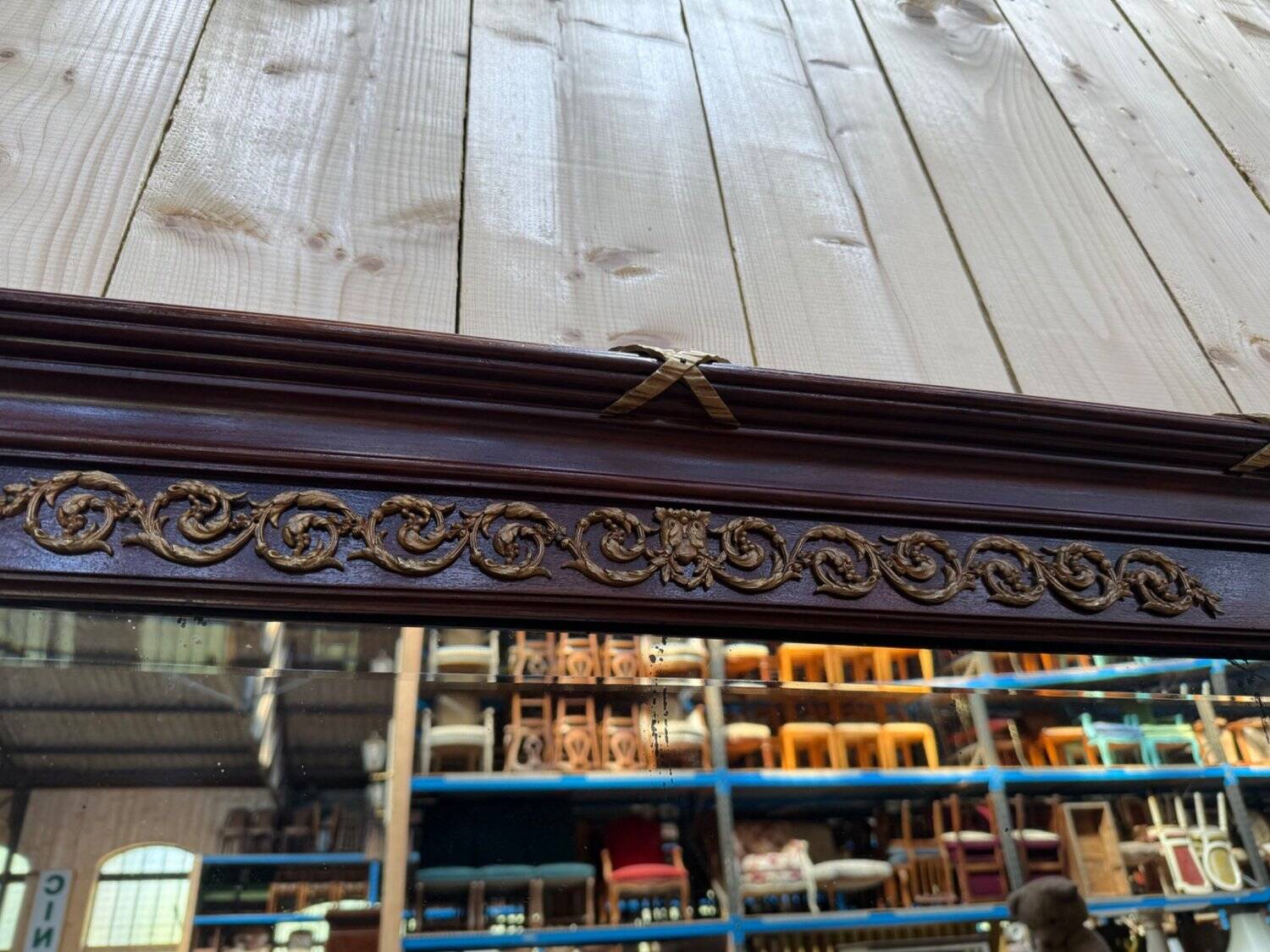 Louis XVI style mirror in mahogany and gold.