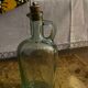 Green pitcher made of vintage glass