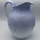 Blue glazed terracotta pitcher with hand-painted decoration, signed