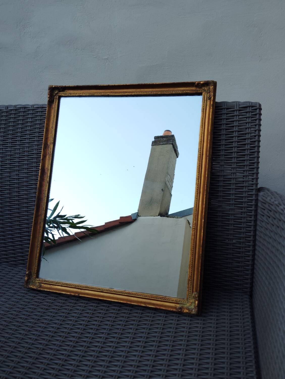 Miroir en bois, doré à la feuille d'or.