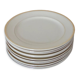 Set of 11 flat white earthenware plates with gold edging