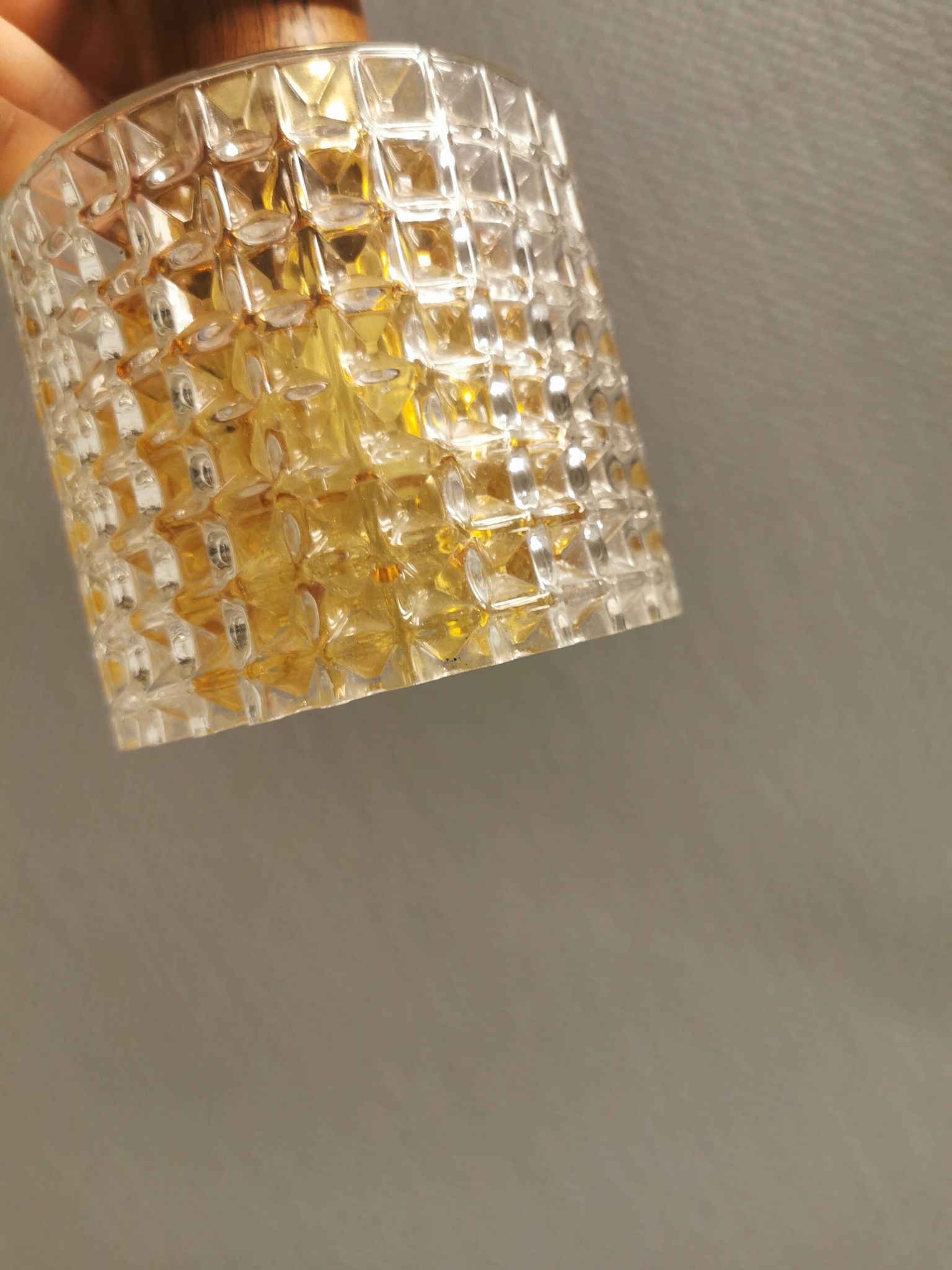Older Swedish hanging lamp in multi-layered crystal glass with rosewood top and brass ring.