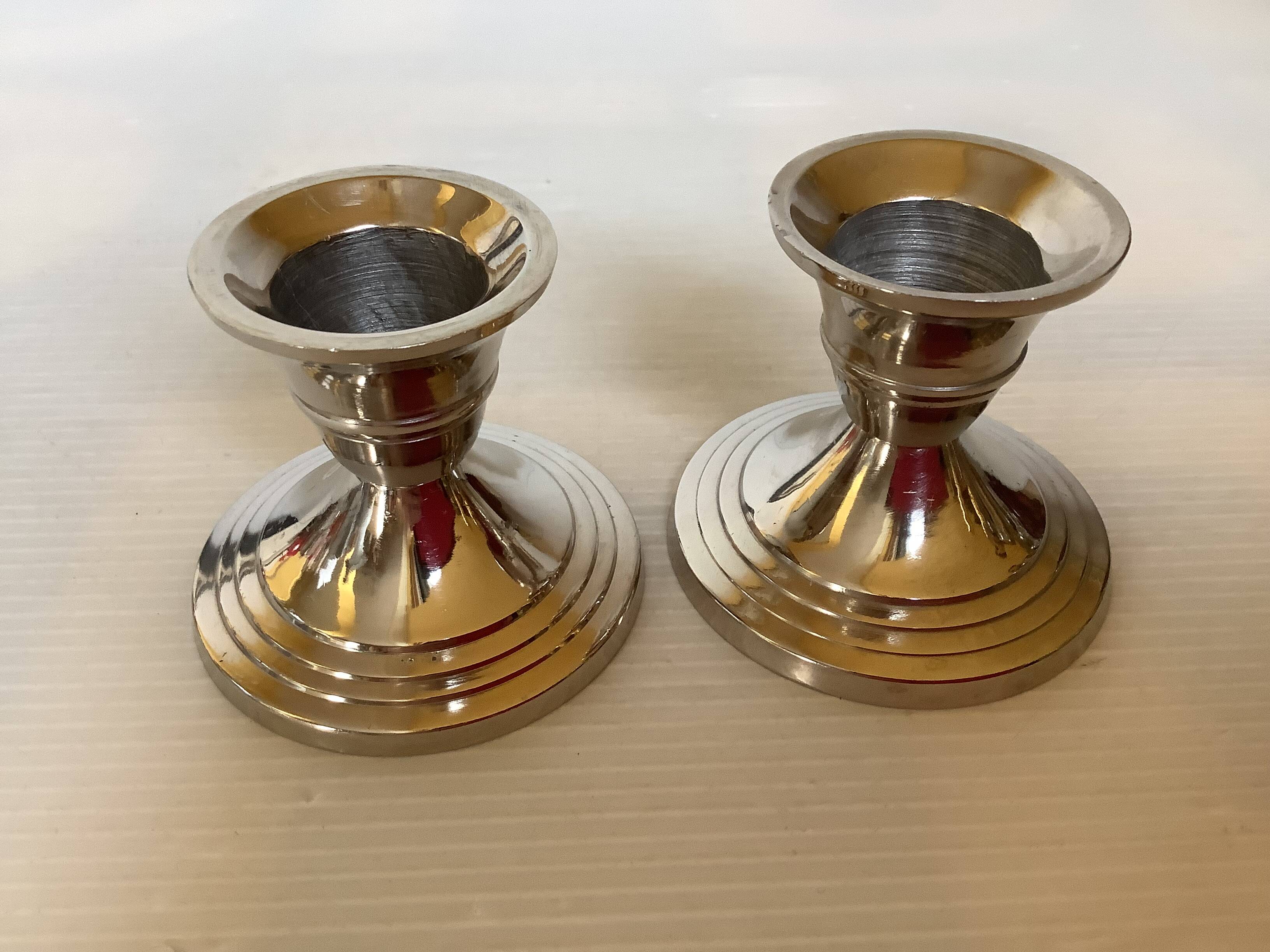 Pair of small silver metal candlesticks