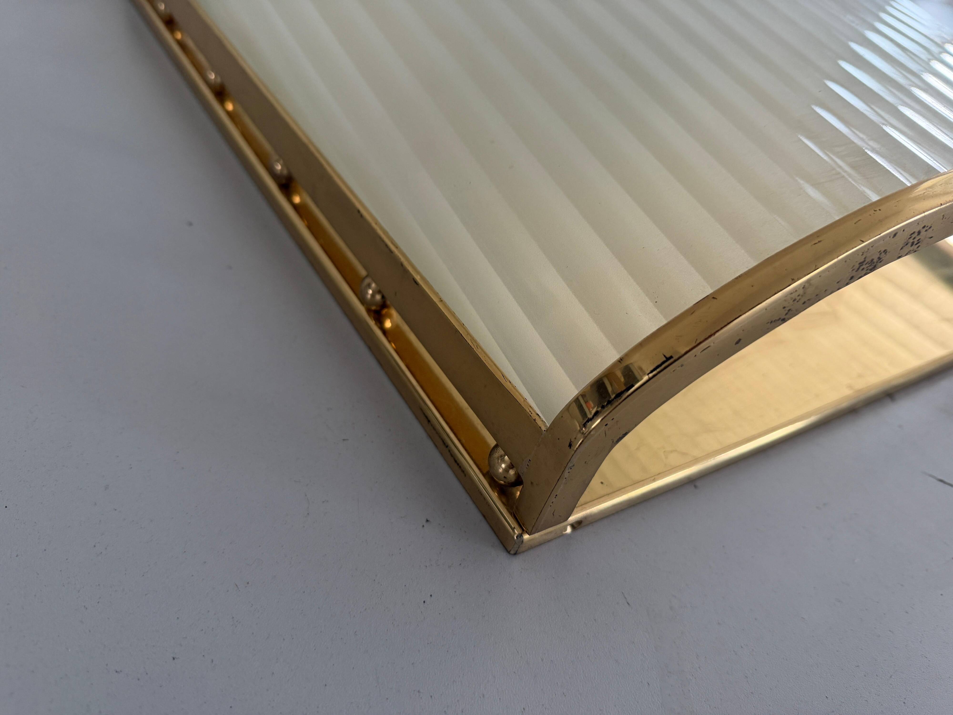 Large heavy glass wall light with a brass frame from the mid-century, 1950s, Italy.