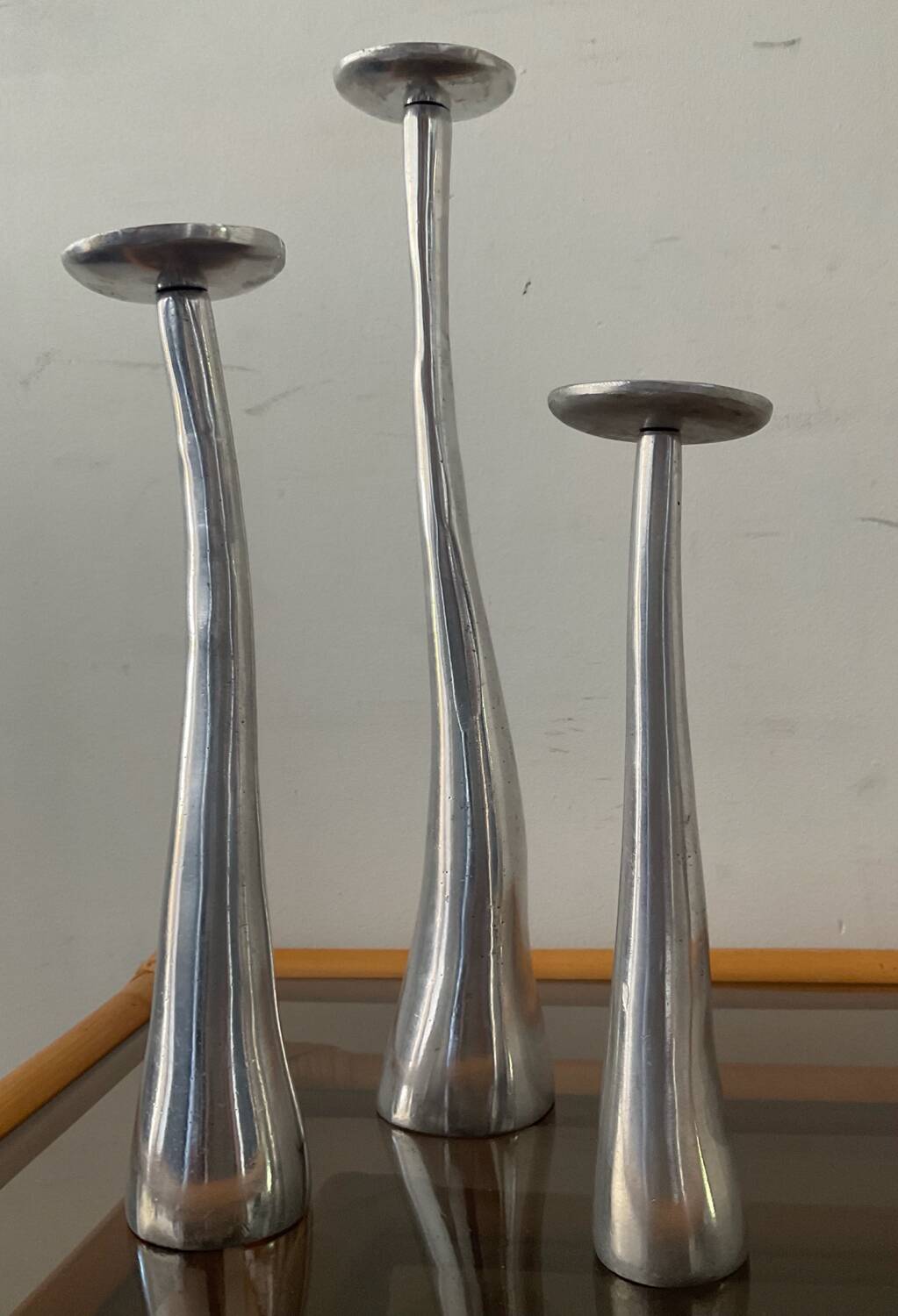Trio of vintage cast aluminum candlesticks