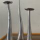 Trio of vintage cast aluminum candlesticks