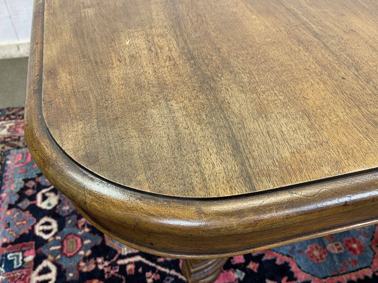 Henri II walnut table from the early 20th century with extensions.