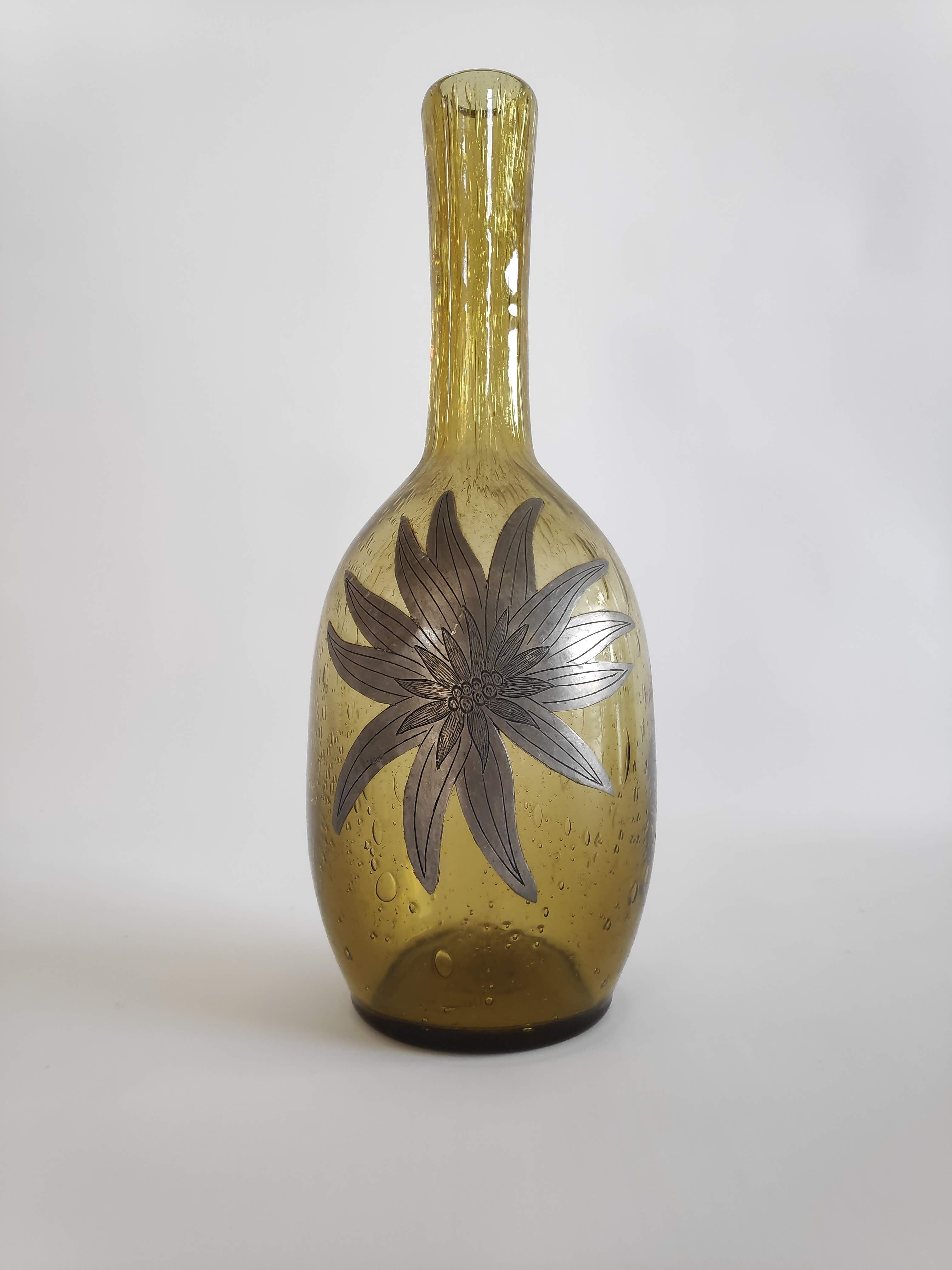 50-year-old soliflora vase in green bulled glass and pewter flower