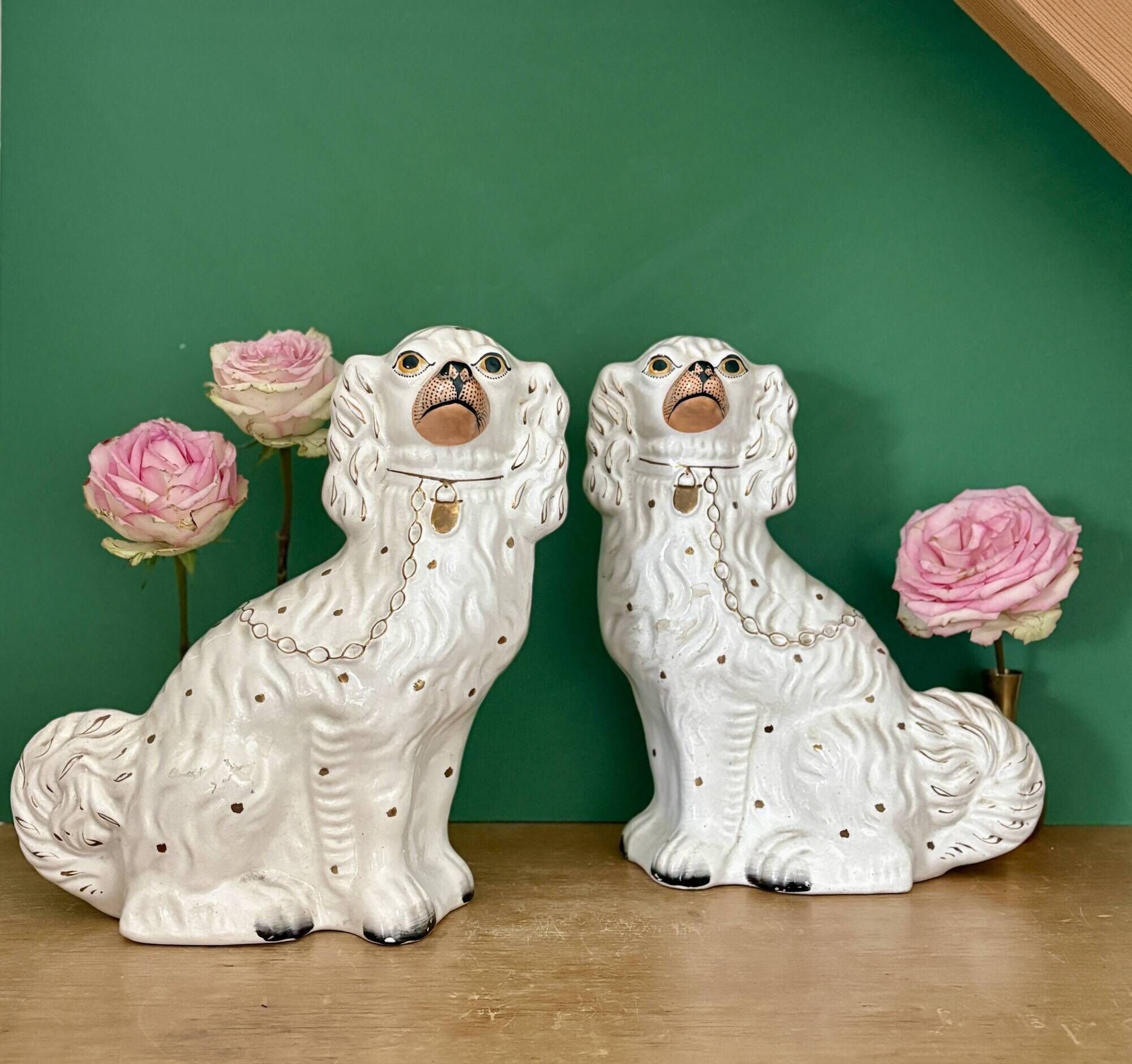 Pair of Staffordshire-type dogs in white and gold ceramic