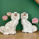 Pair of Staffordshire-type dogs in white and gold ceramic