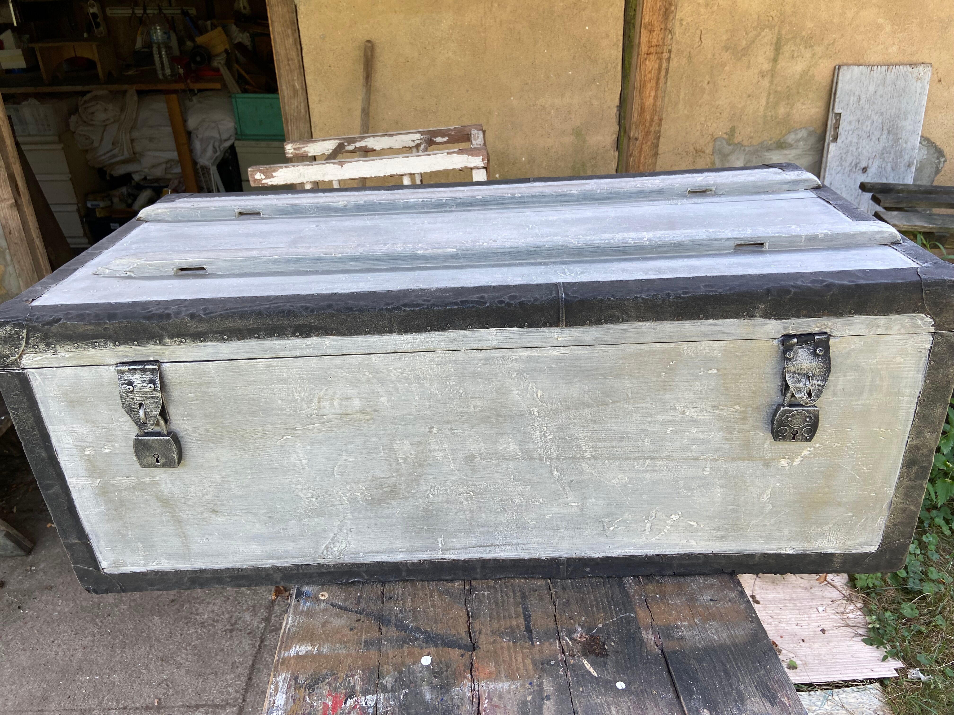 Restored wooden trunk patinated grey