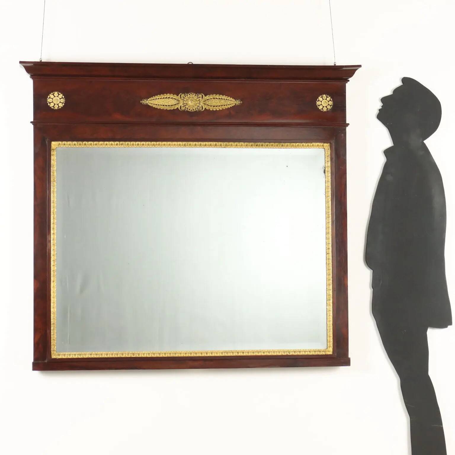 Antique Empire fireplace mirror in mahogany with a bronze frame, Italy, 19th century.