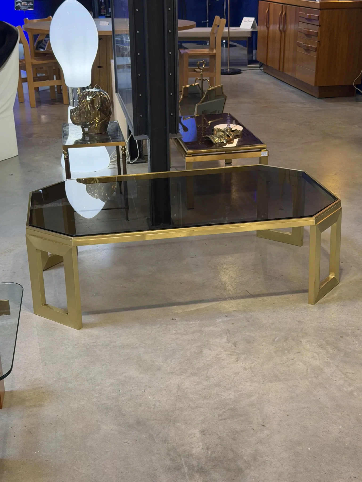 Octagonal brass coffee table, signed Anna Nora.