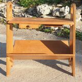 Magazine rack with sliding drawers in light wood, Scandinavian style.