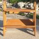 Magazine rack with sliding drawers in light wood, Scandinavian style.
