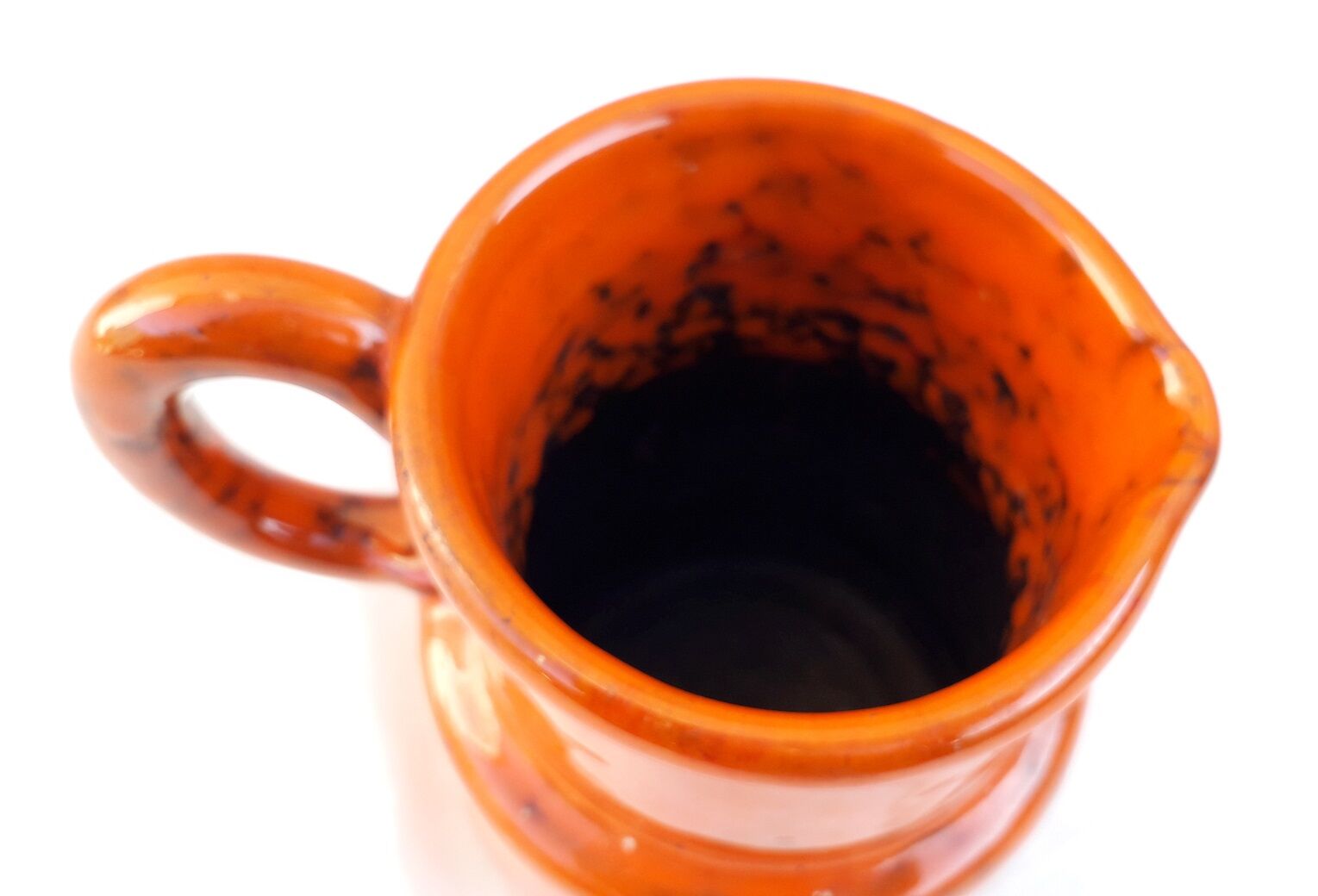 Orange ceramic pitcher