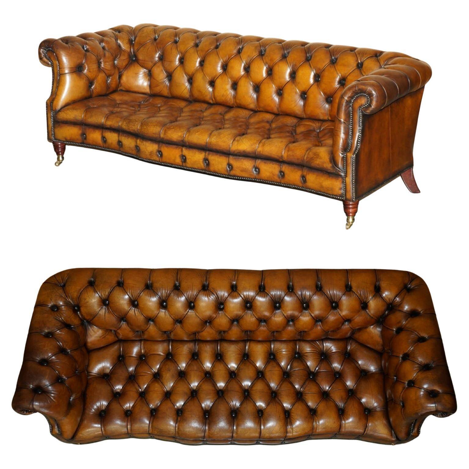 Vintage Chesterfield serpentine luxury sofa in restored leather