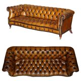 Vintage Chesterfield serpentine luxury sofa in restored leather