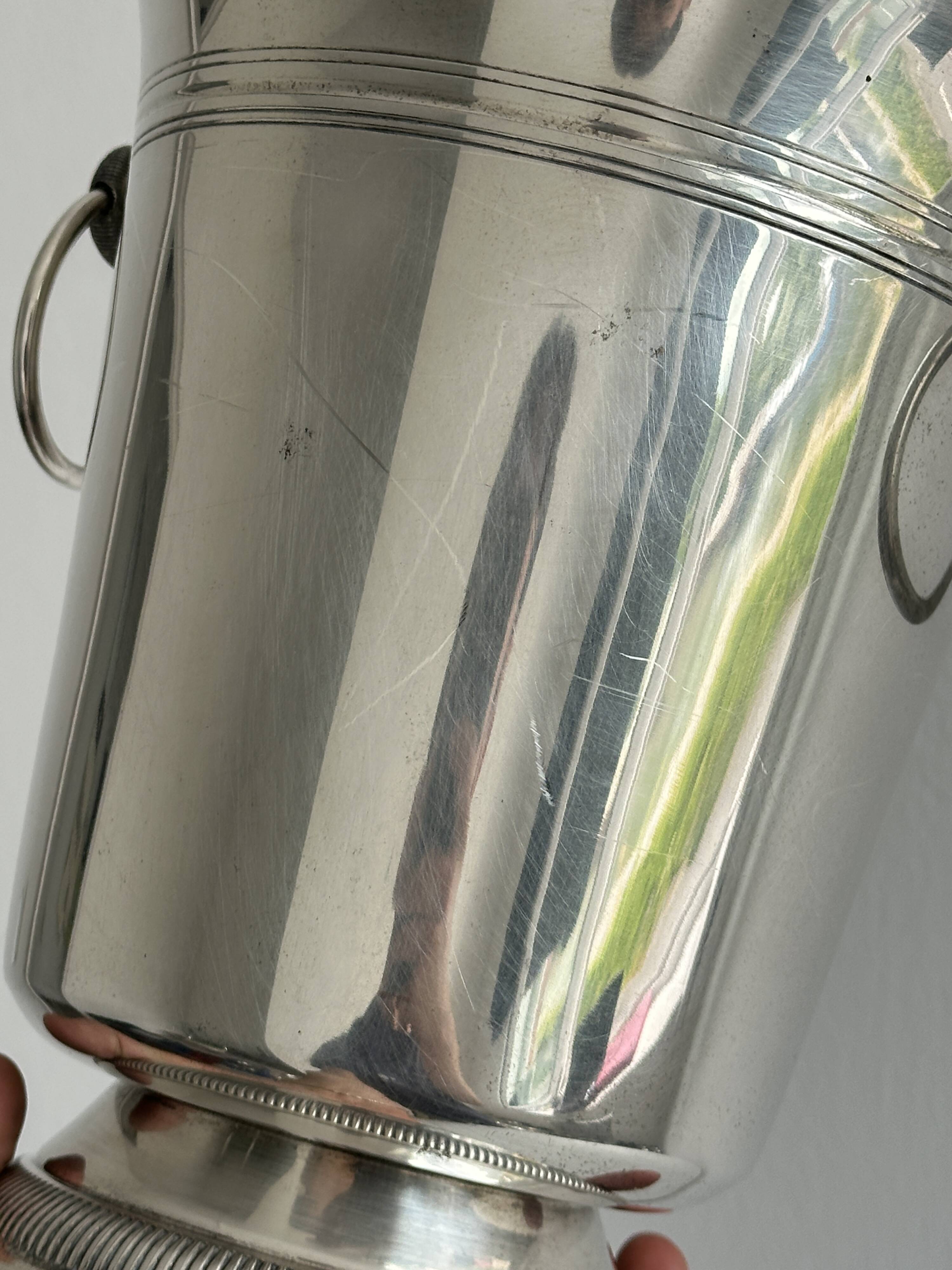 Antique champagne bucket in shiny silver metal