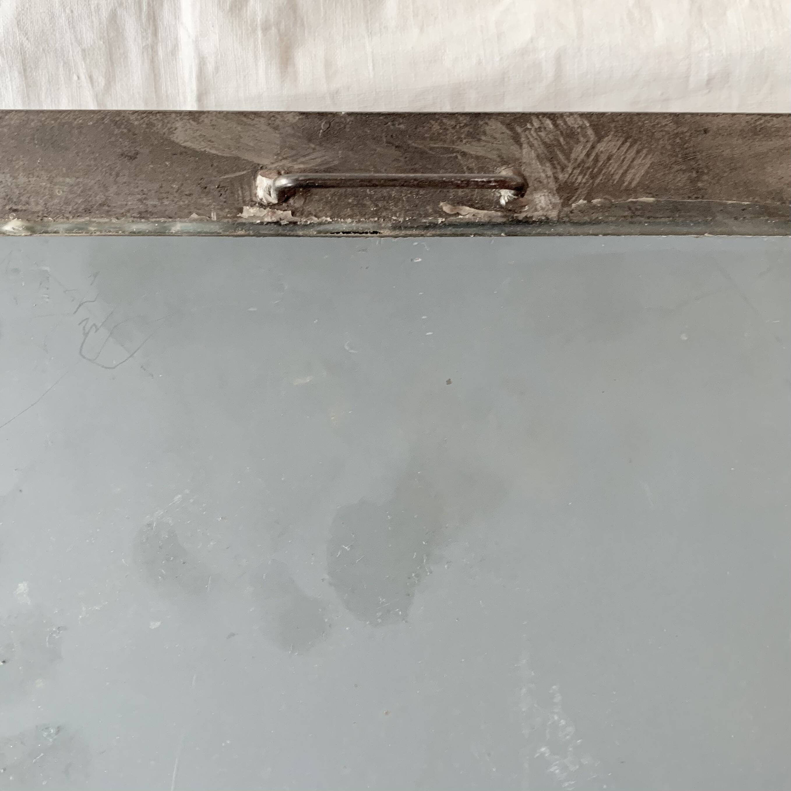 Vintage wall mirror in varnished steel decorated with a rose in relief