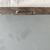 Vintage wall mirror in varnished steel decorated with a rose in relief