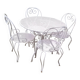 Mategot-style perforated wrought iron garden furniture with table and armchairs