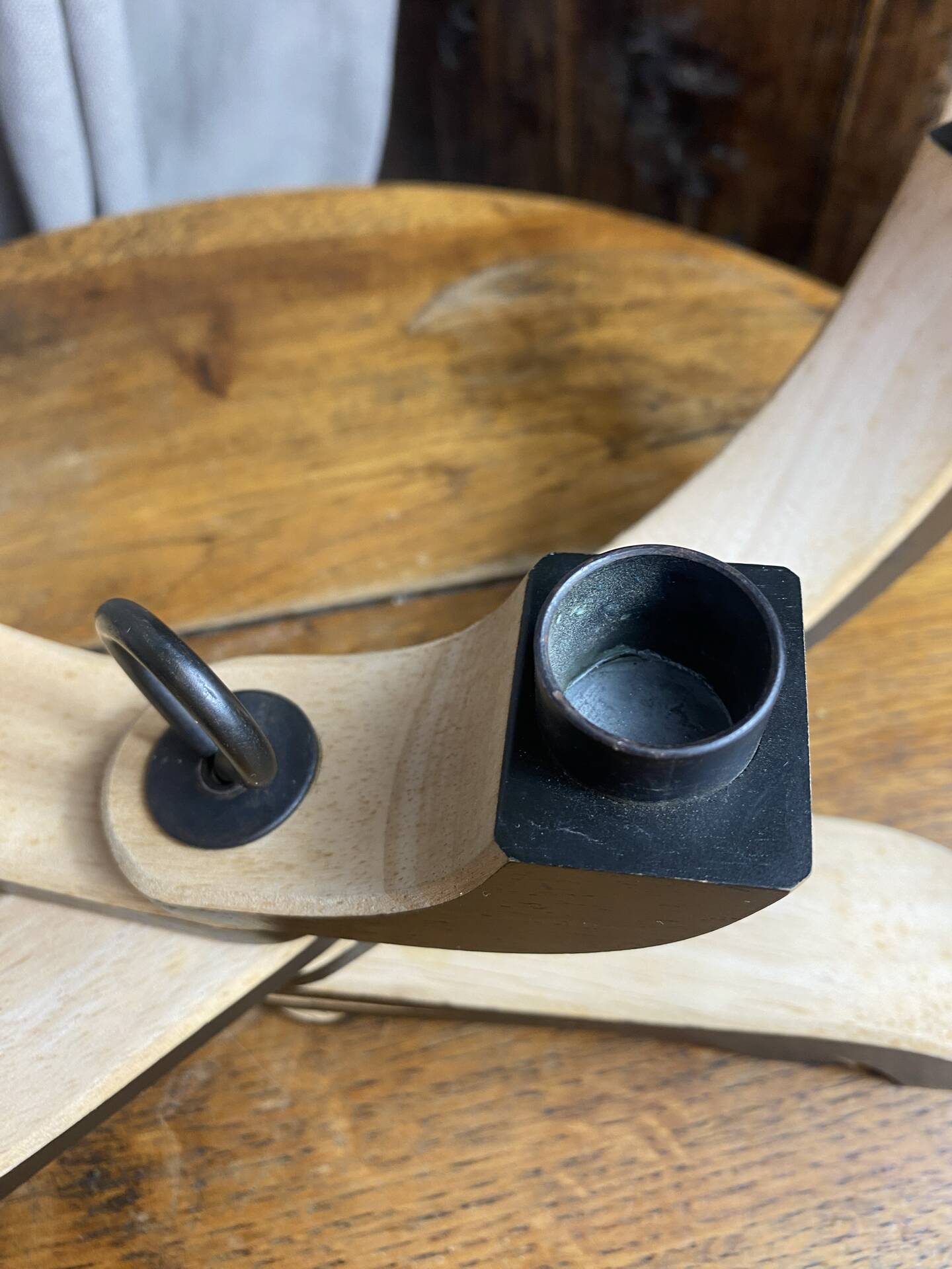 Foldable and deconstructed chandelier, minimalist Swedish design in wood.