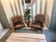 Pair of vintage Chesterfield club armchairs in brown tufted leather –