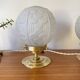 Pair of Art Deco glass globe table lamps with brass base.