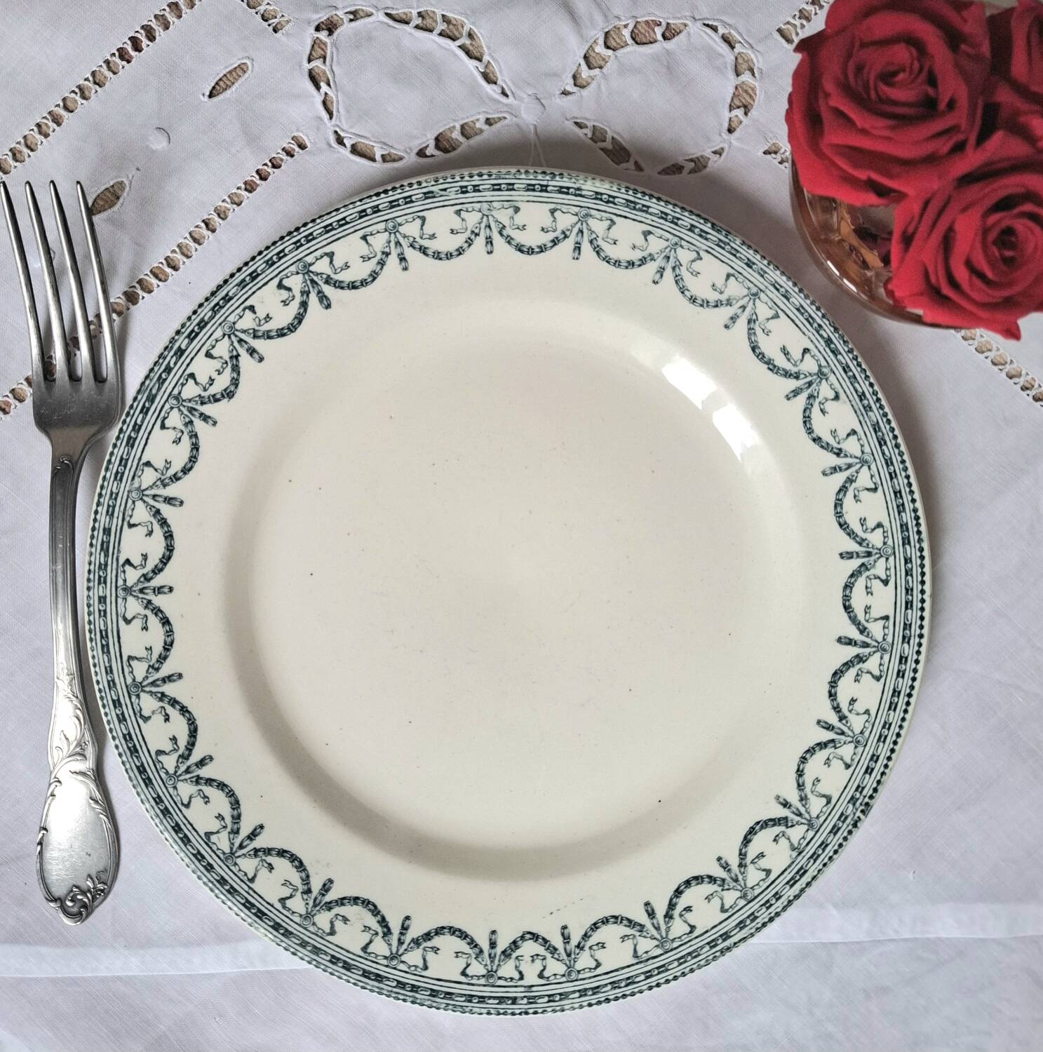 Old mismatched flat plates in iron earth earthenware accompanied by a dish
