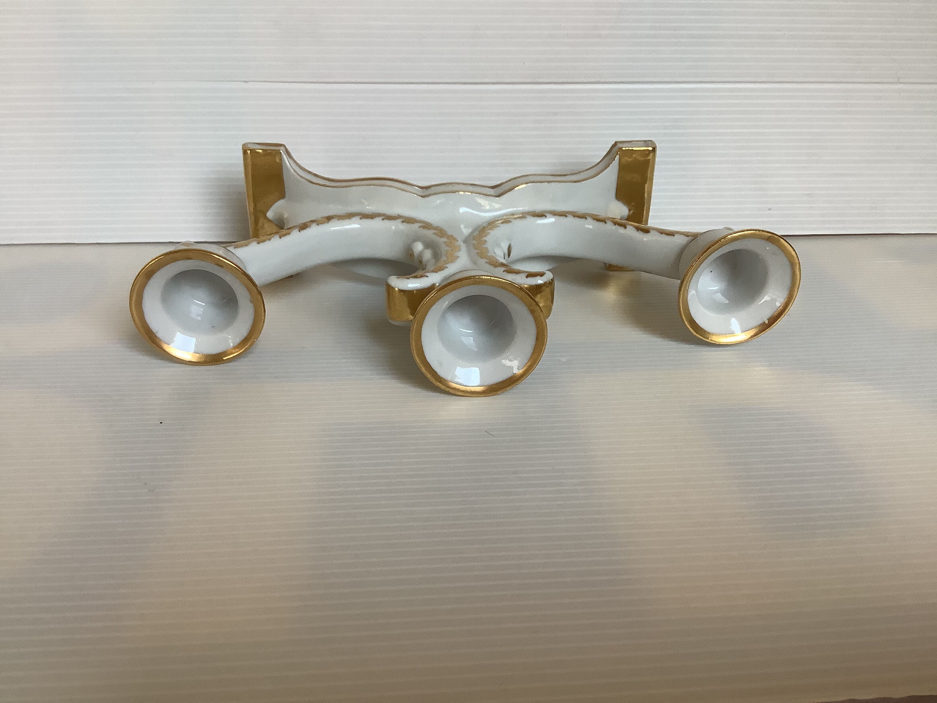 Old white and gold candlestick Belgium