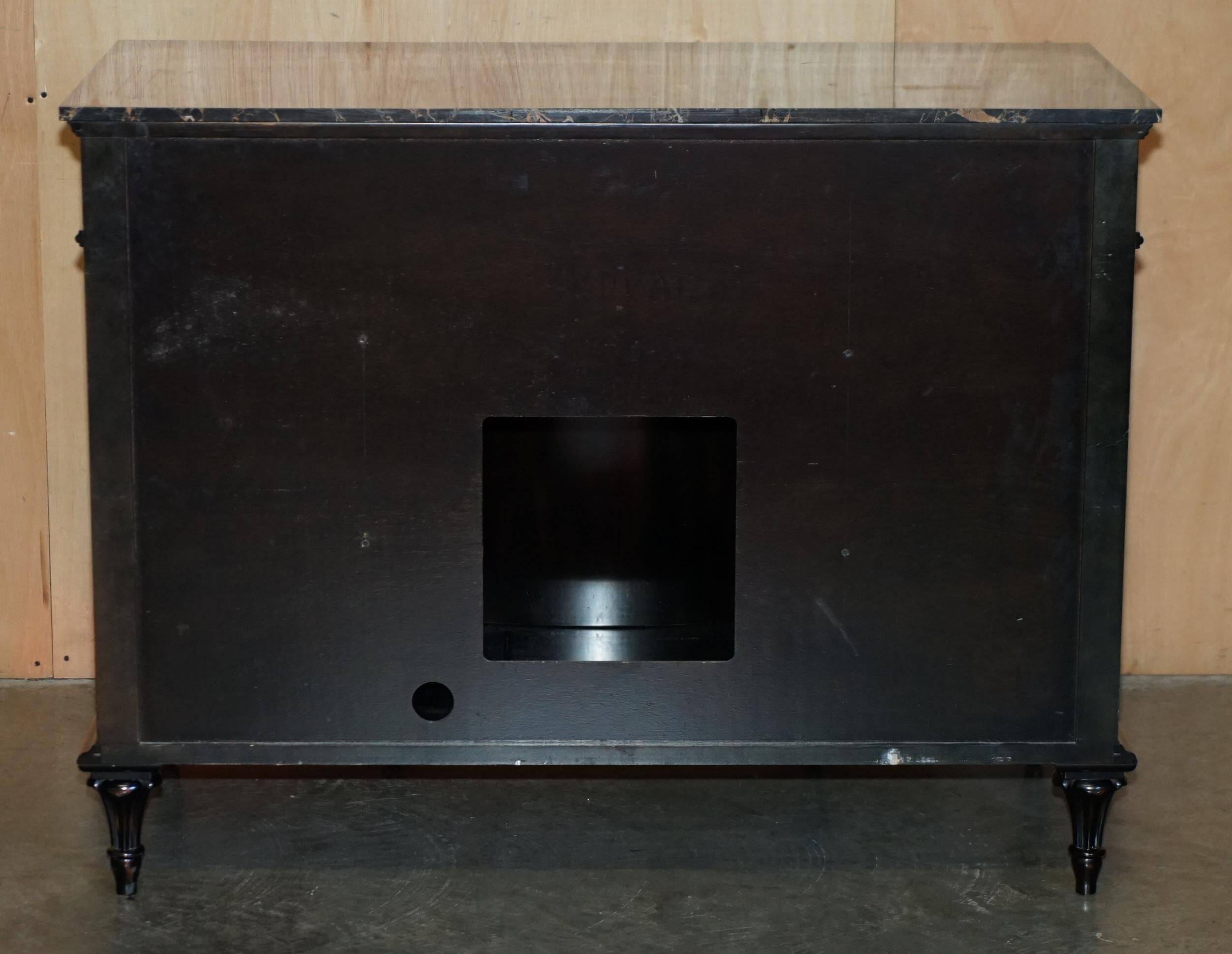 Contemporary Chinese buffet with a marble top and space for a mini-fridge.