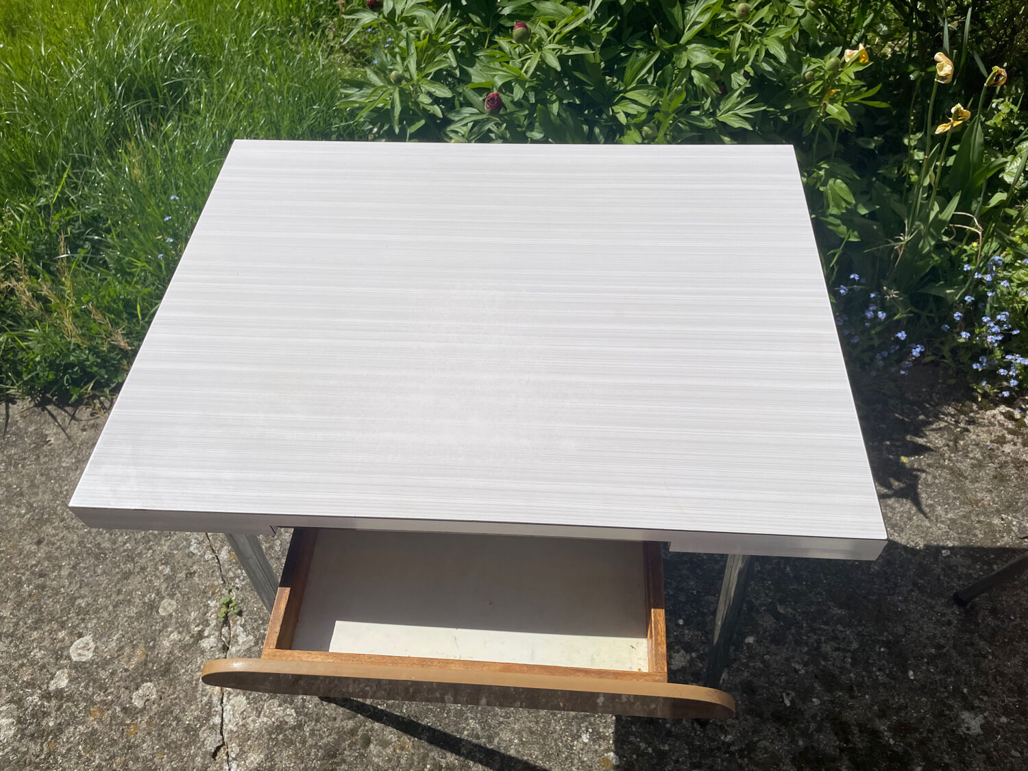 Formica table with a red Mid-century chair.