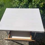 Formica table with a red Mid-century chair.