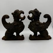 Pair of winged chimera and dragon fire dogs in cast iron