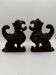 Pair of winged chimera and dragon fire dogs in cast iron