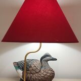 Decorative table lamp with a sculpted duck-shaped base and painted finish.