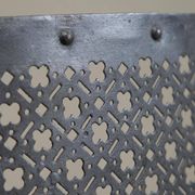 Half-moon antique wrought iron fire screen from the 19th century.