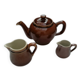Brown ceramic teapot and milk jugs