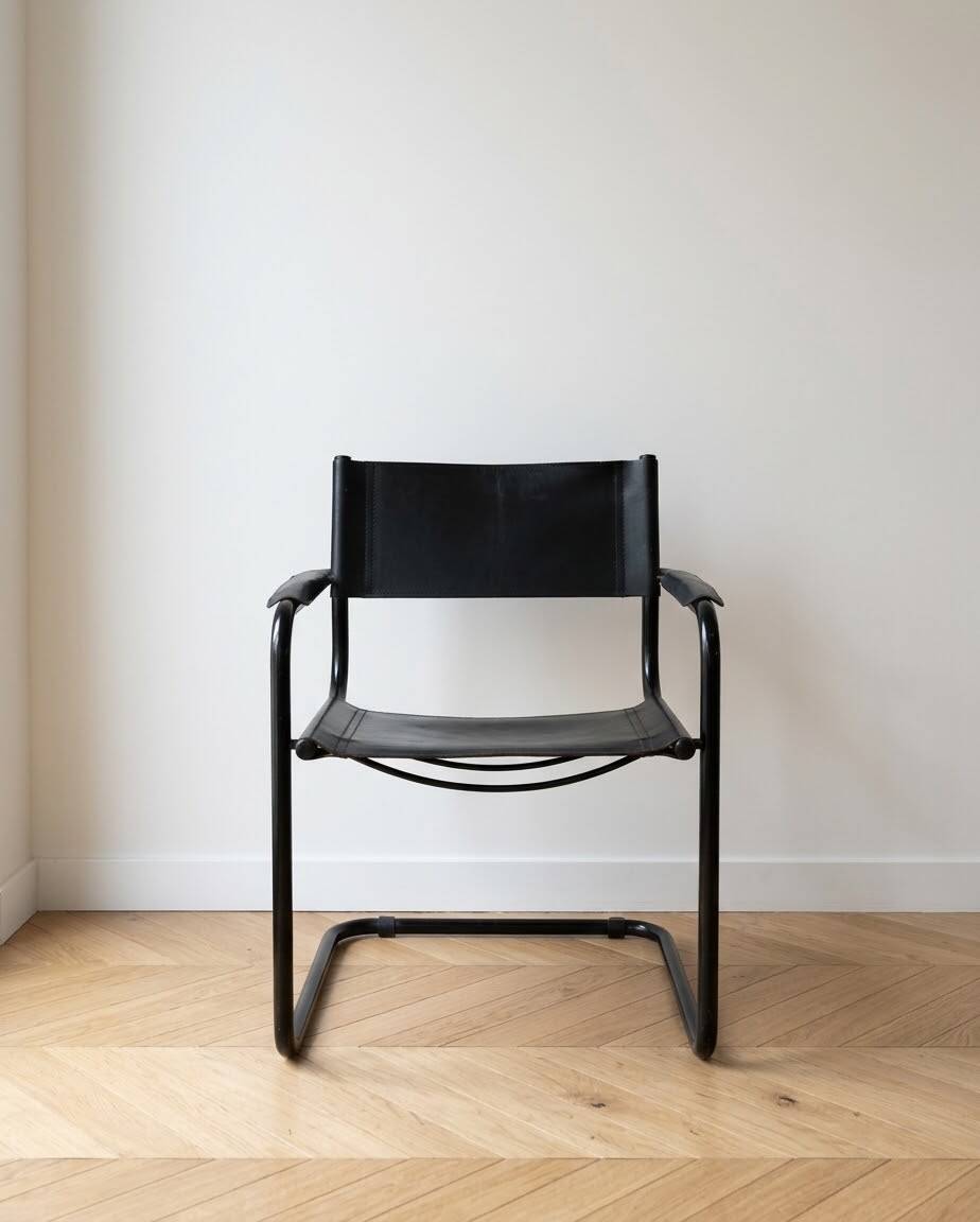 Vintage Bauhaus style cantilever armchair in black metal and leather.