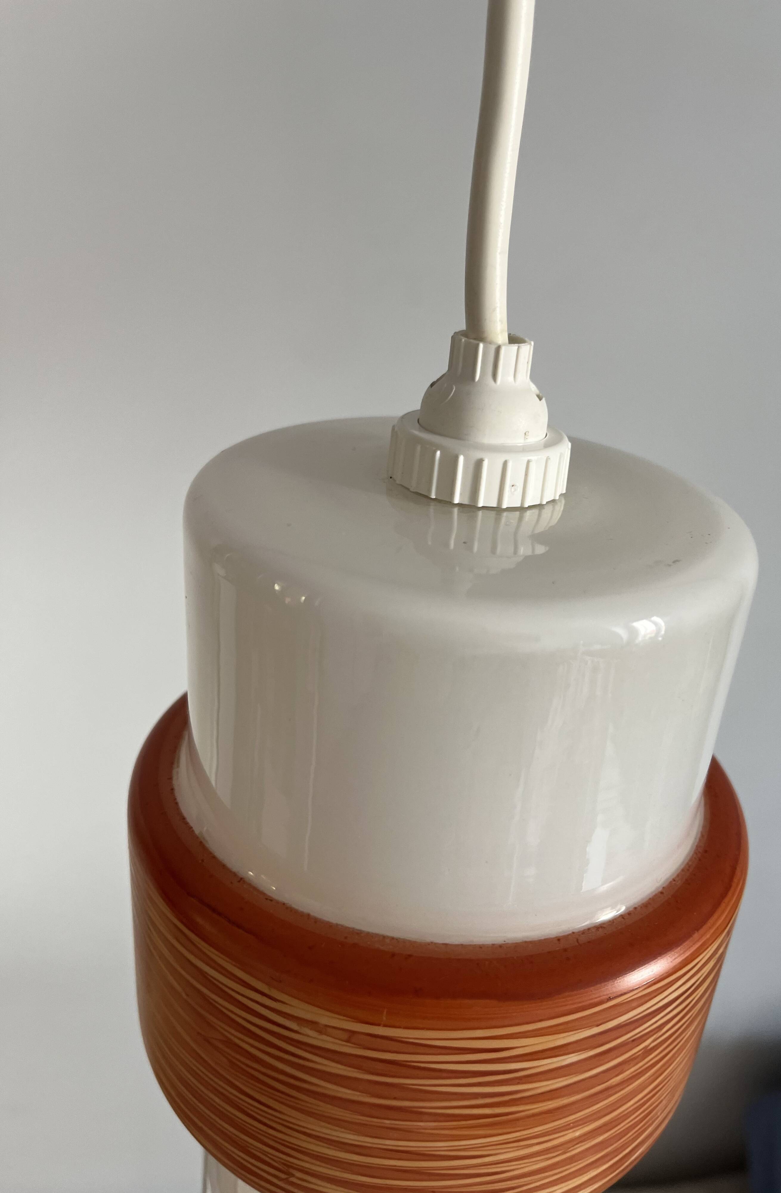 Sputnik pendant light, dark orange ring on white tube