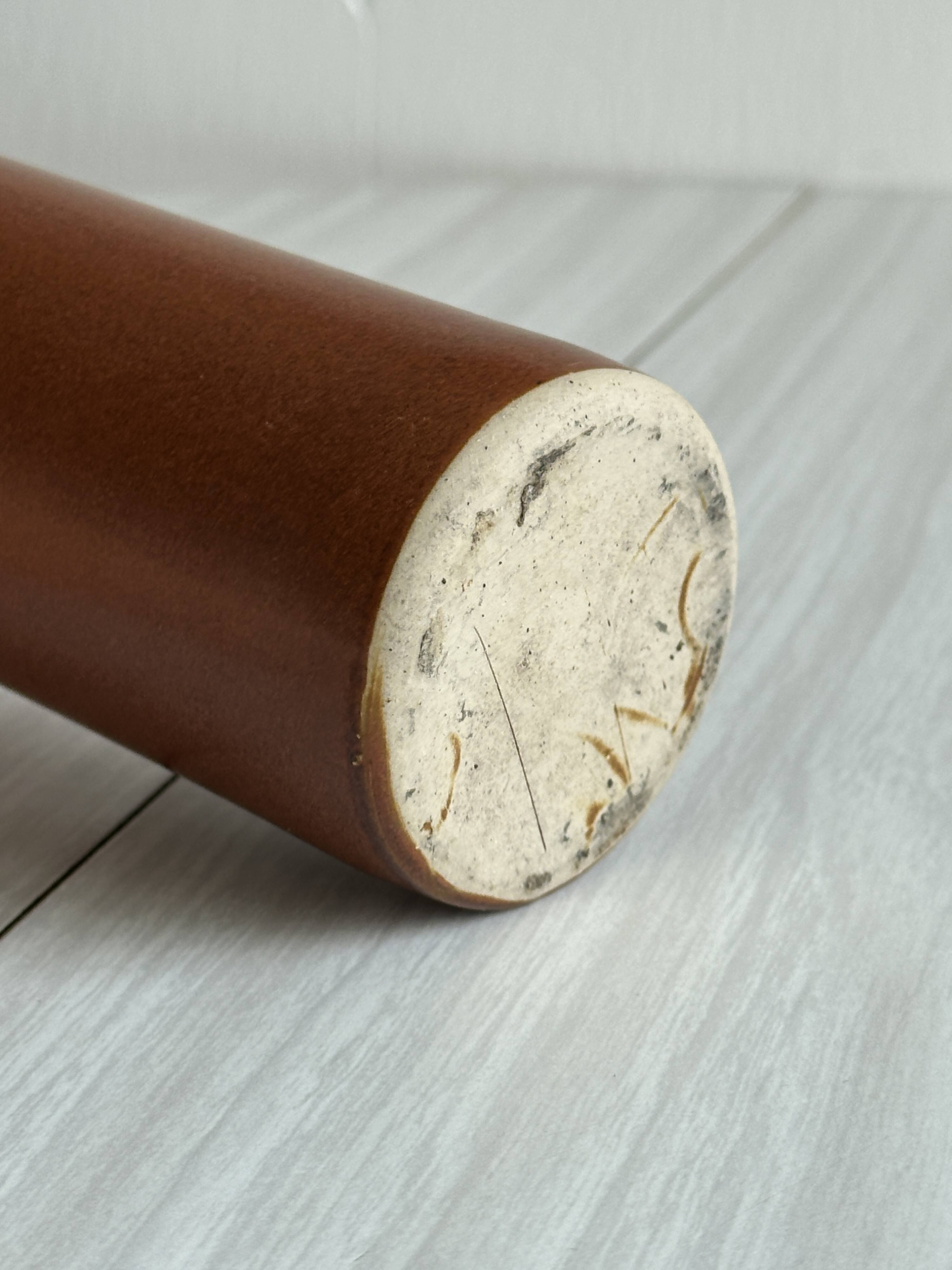 Decorative brown ceramic bottle.