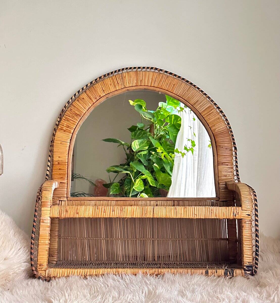 Woven rattan and wicker shelf mirror in the Emmanuelle style, Spain, 1970s.