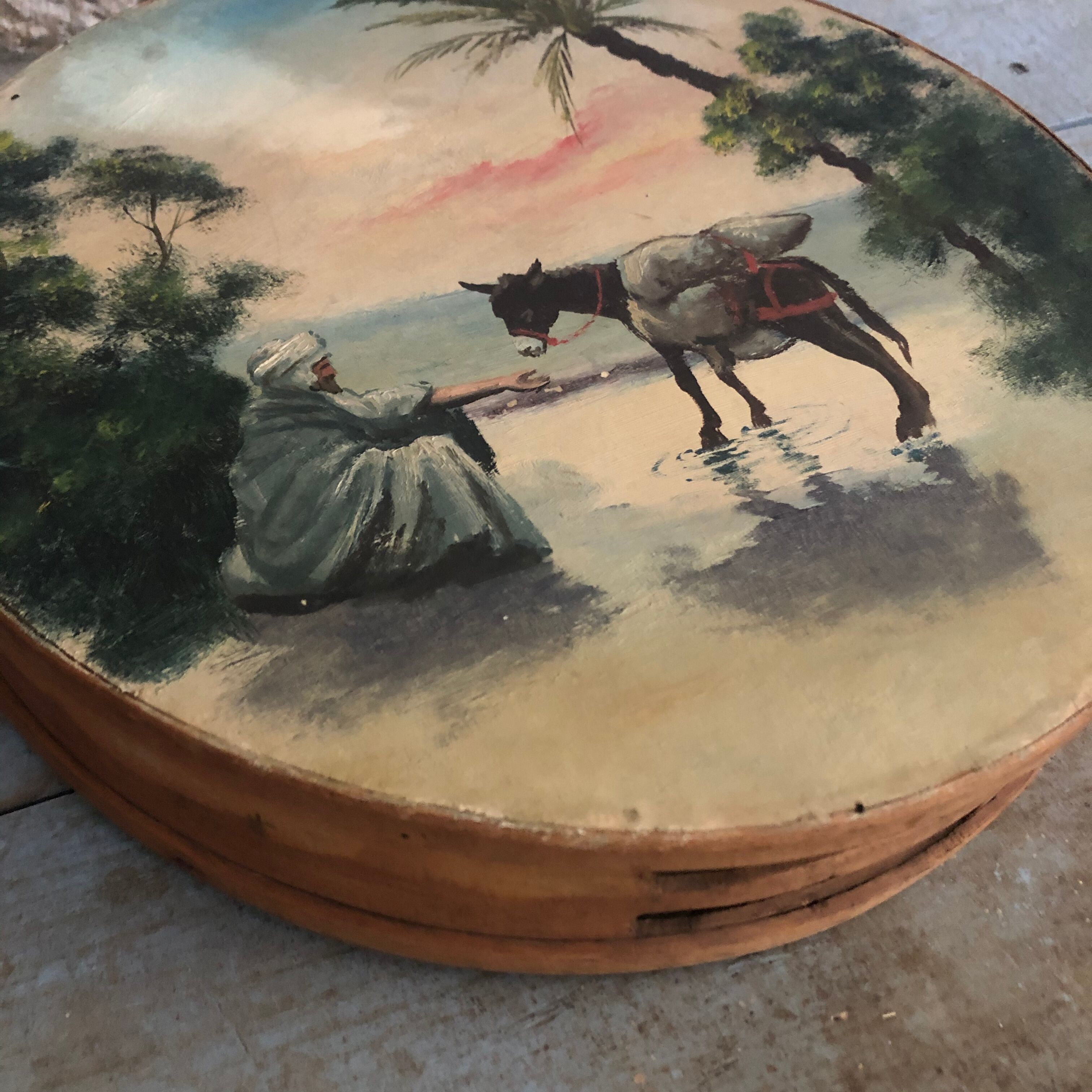 Ancient painted tambourine, oriental scene