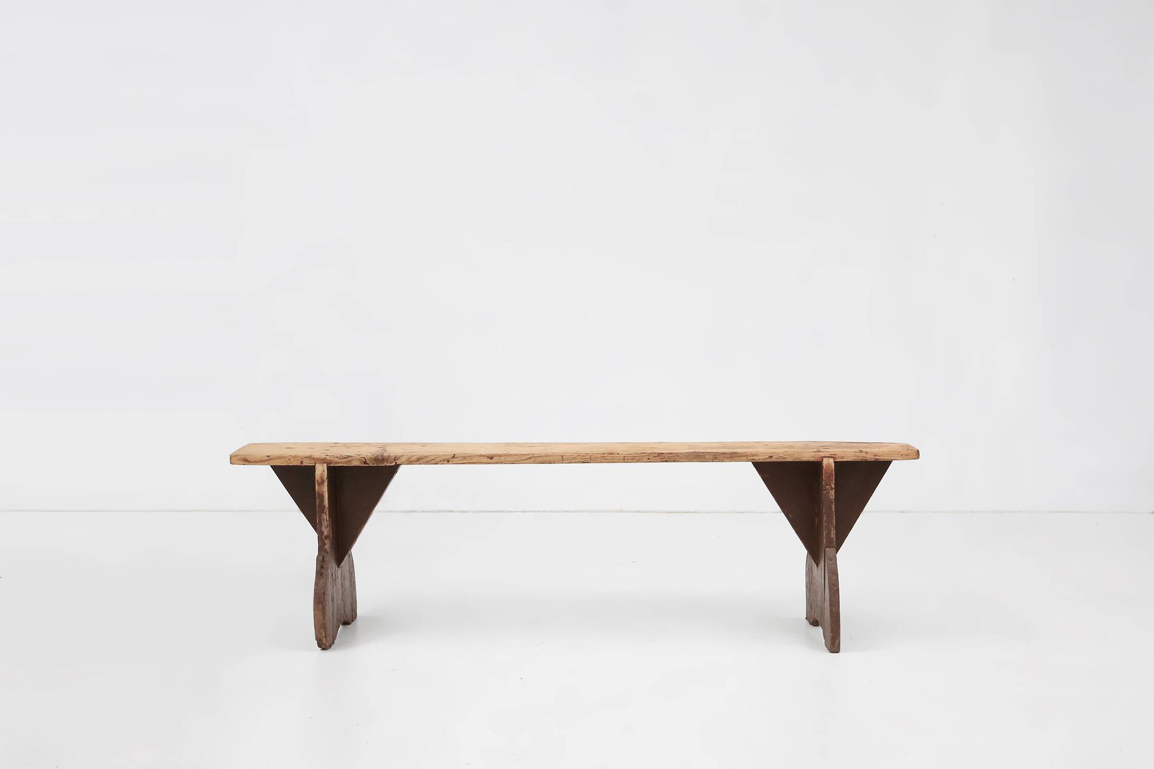 Rustic wooden bench in with brown painted feet, France ca. 1890