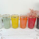 6 colorful juice glasses in their vintage basket